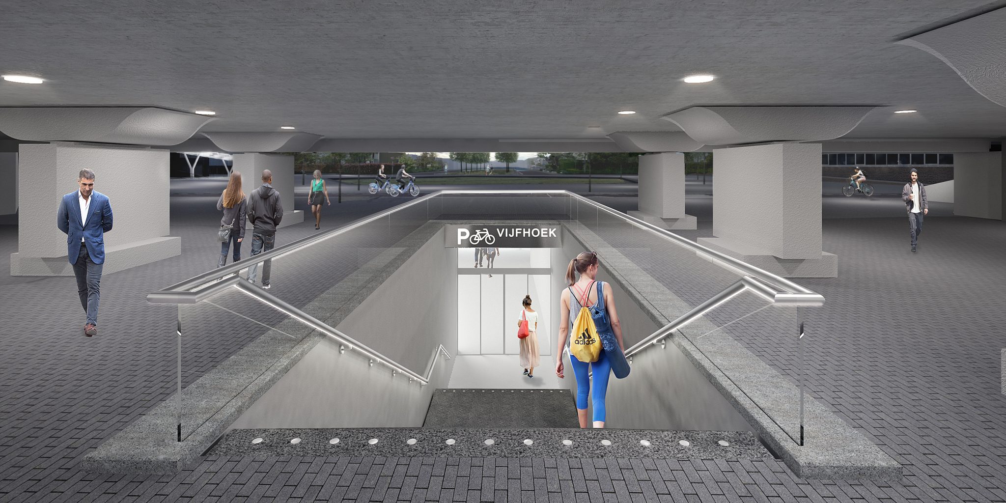 Een brede trap in een korte tunnel vormt de voetgangersentree van de stalling. Zo kunnen reizigers vanuit het station de stalling bereiken zonder het drukke fietspad te hoeven oversteken.